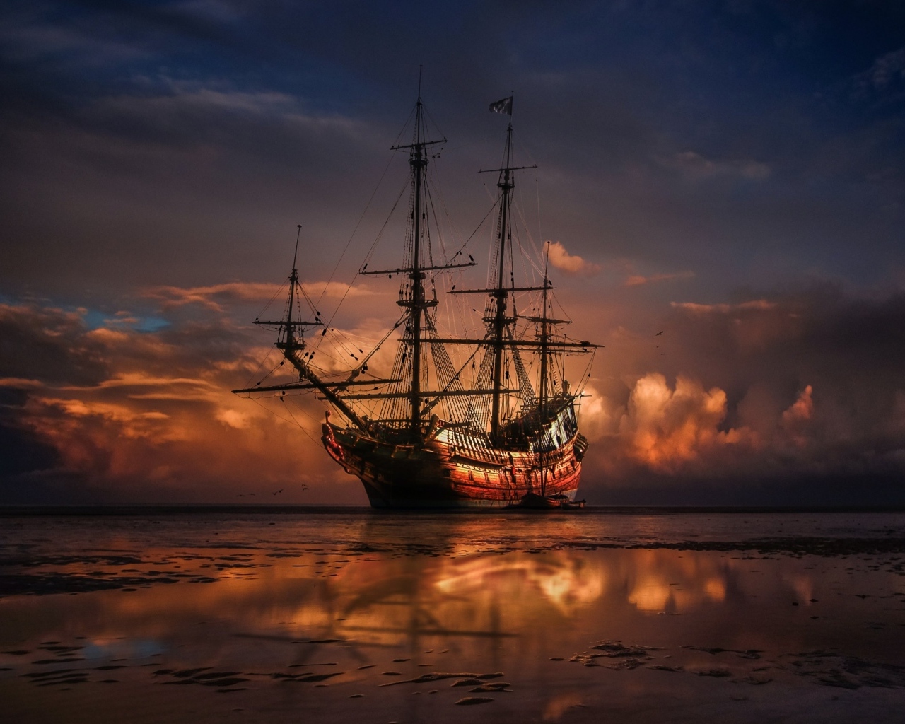 Большой корабль идет на мель на закате