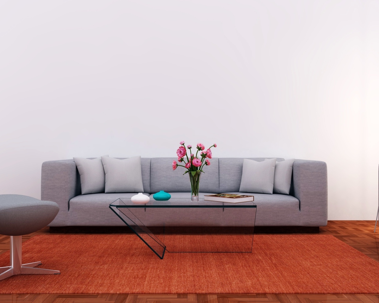 Большой серый диван в комнате с серой стеной