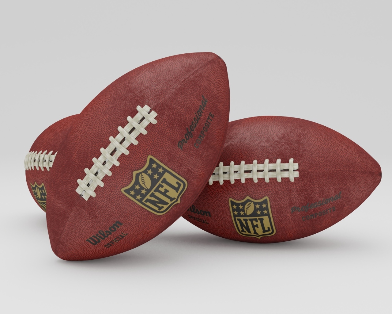 Два мяча для игры американский футбол на сером фоне