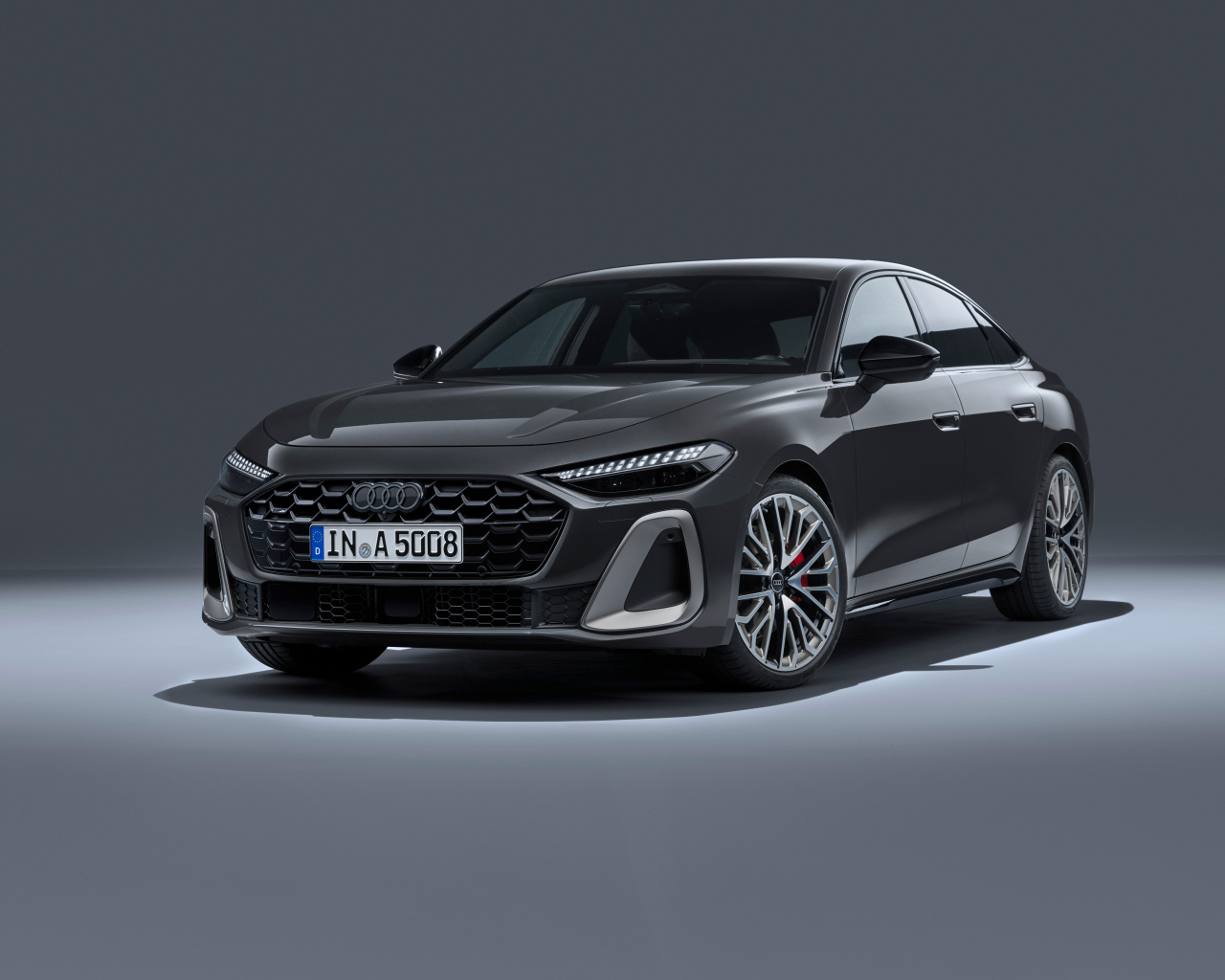 Автомобиль Audi A5 TFSI quattro S line 2024 года на сером фоне