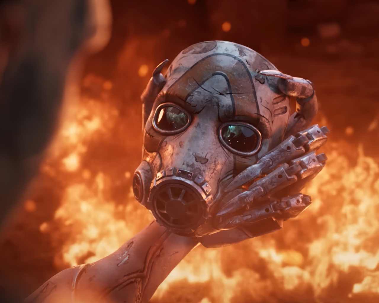 Маска в руках на фоне огня в видеоигре Borderlands 4