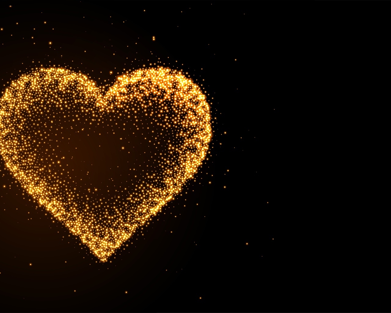 Яркое золотое сердце на черном фоне