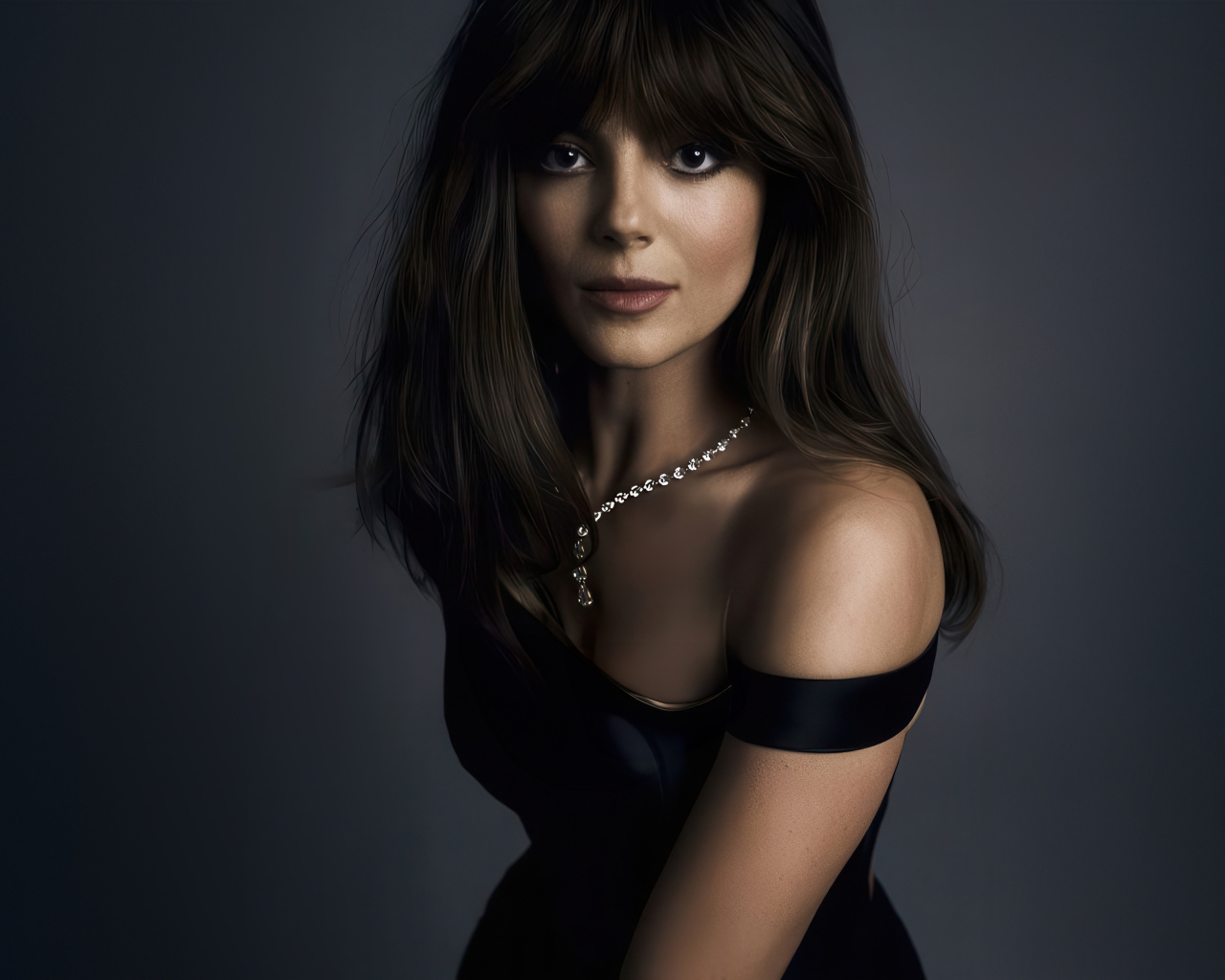 Жгучая брюнетка актриса Моника Барбаро на сером фоне