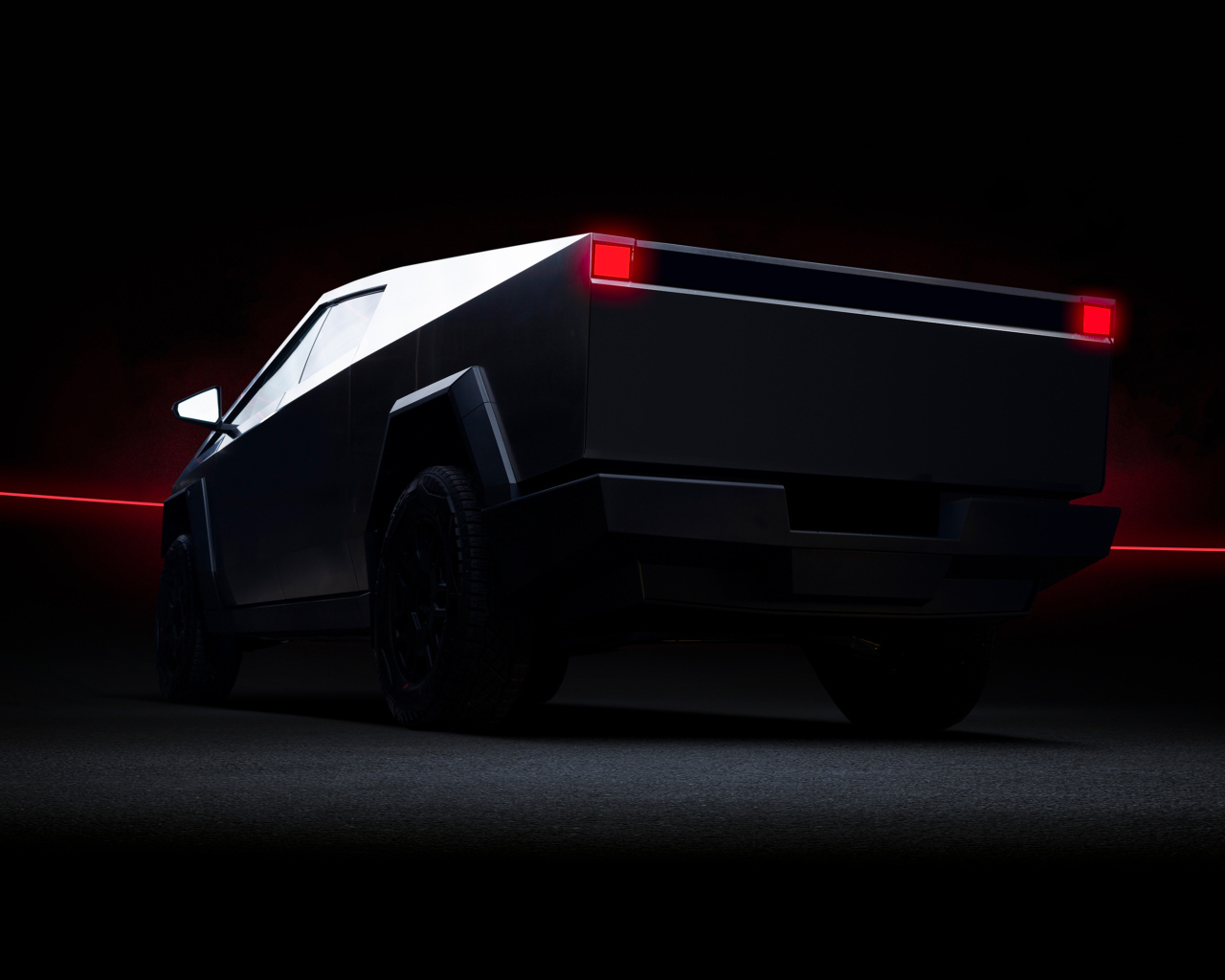 Вид сзади на автомобиль Tesla Cybertruck Dark