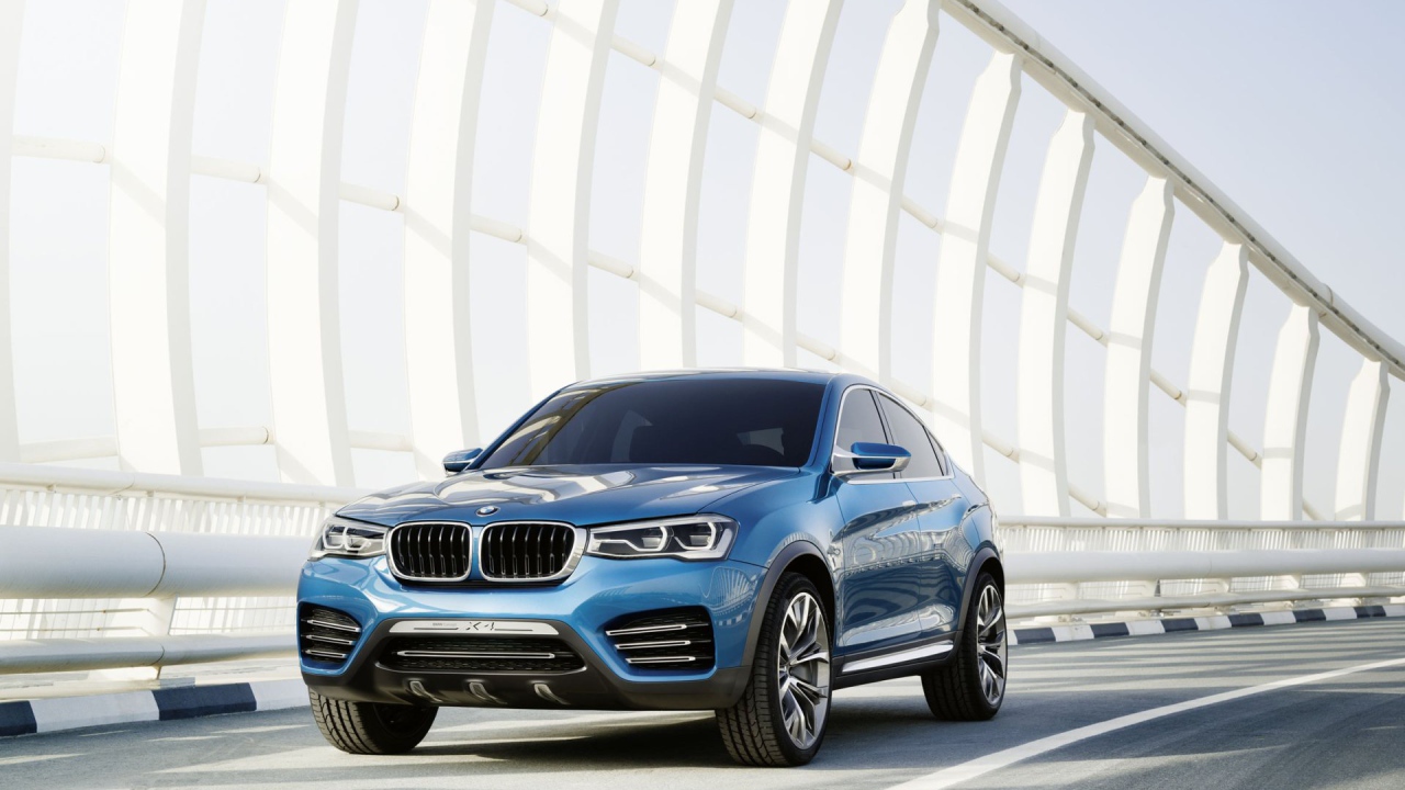 The blue BMW X4 crossover on the road