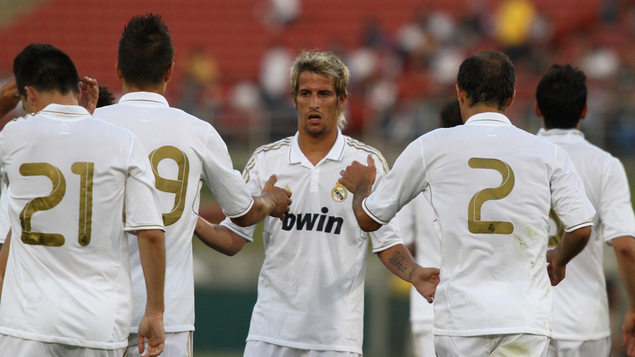 The player of Real Madrid Fábio Coentrão surrounded by his team
