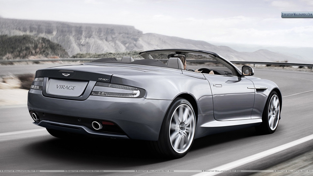 Автомобиль Aston Martin virage на дороге