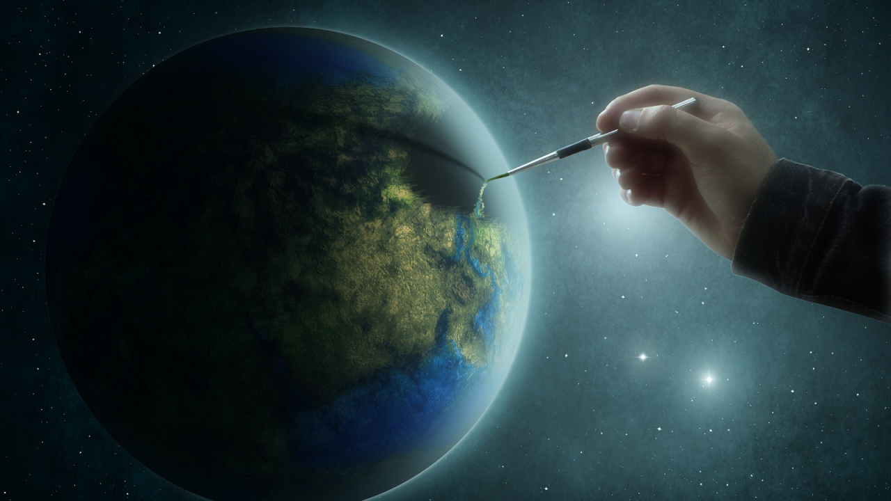 Рука рисует на планете