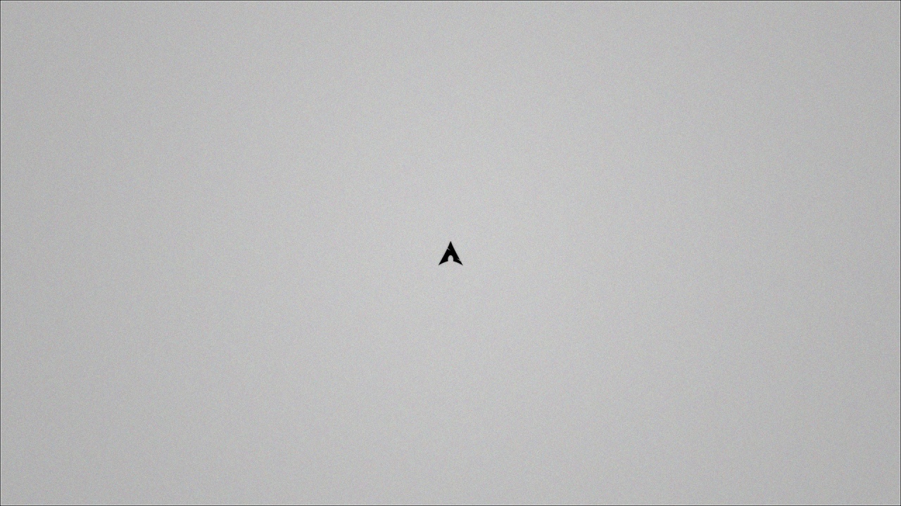 Маленький черный треугольник на сером фоне