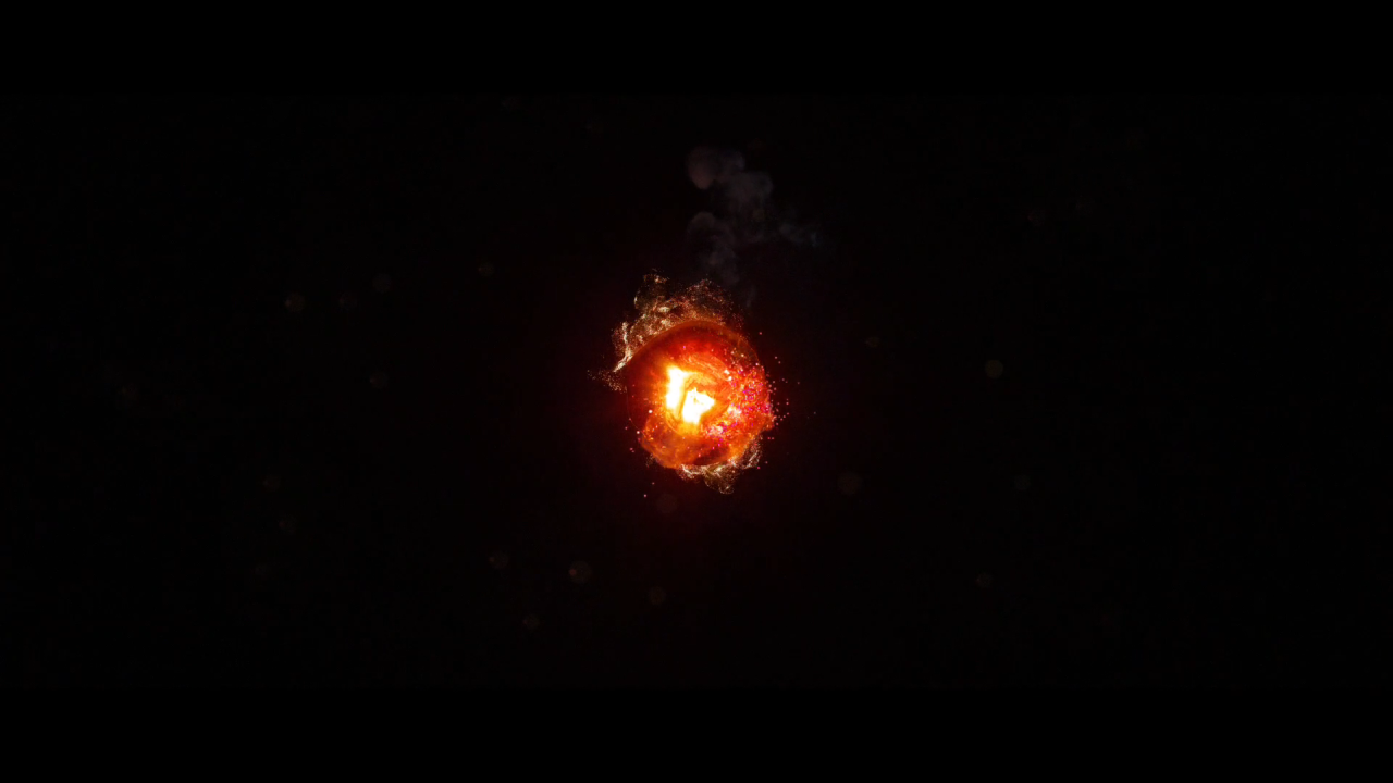 Горящий уголек, черный фон