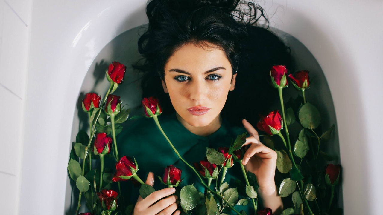Aurela Skandaj brunette among the roses in the bathroom