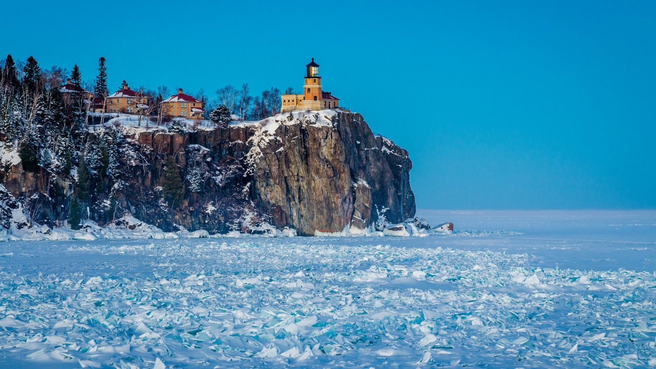 Lighthouse over the frozen sea