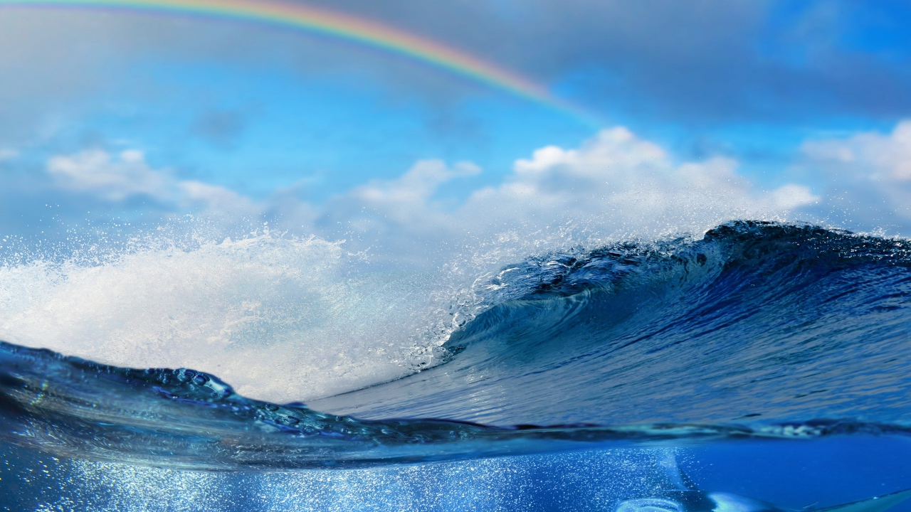 Rainbow over the sea waves