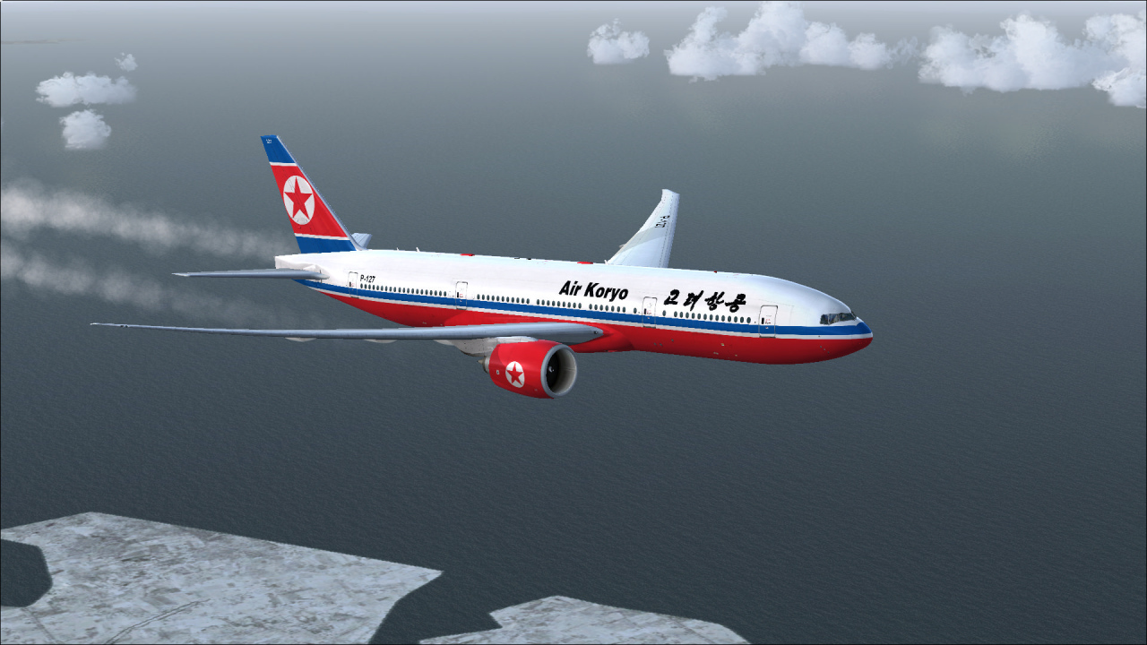 A passenger plane Boeing 777-200LR Air Koryo airline flies over the ocean