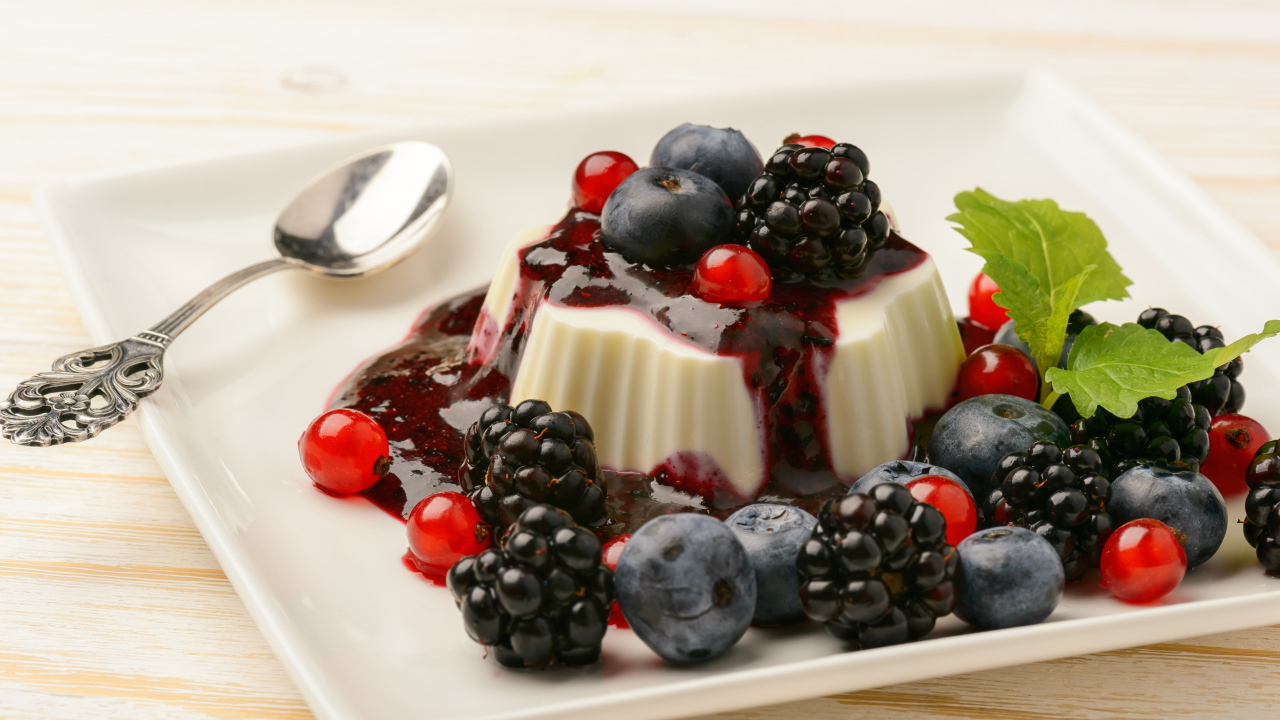 Appetizing jelly with blueberries, currants and blackberries and jam