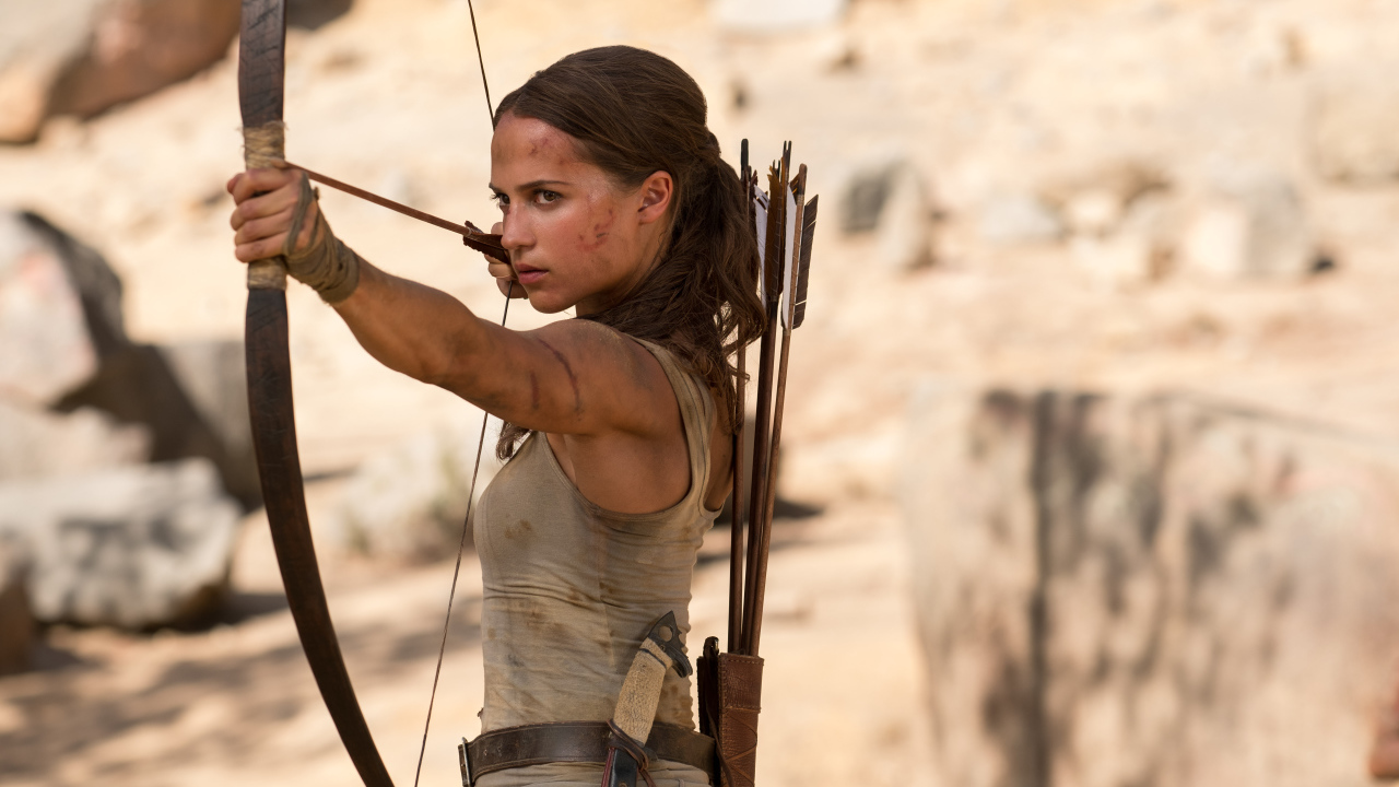 Actress Alicia Vikander with a bow in the movie Tomb Raider. Lara Croft, 2018