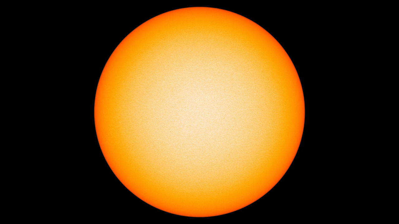 Яркое желтое солнце на черном фоне