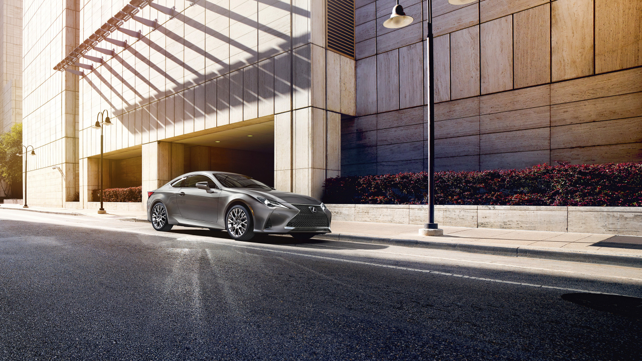 Silver car Lexus RC 300, 2019 in front of the building