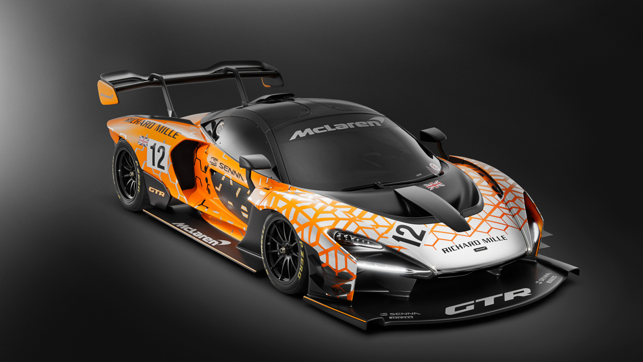 Гоночный автомобиль McLaren Senna GTR Concept на сером фоне