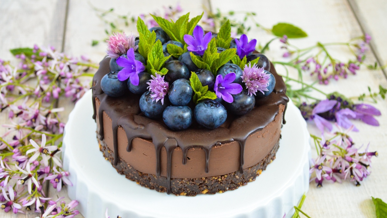 Chocolate cake with blueberries and flowers