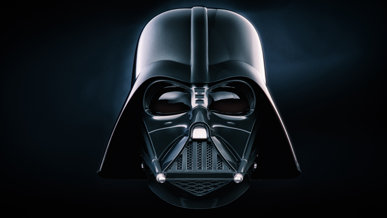 Face in a mask of Darth Vader on a black background
