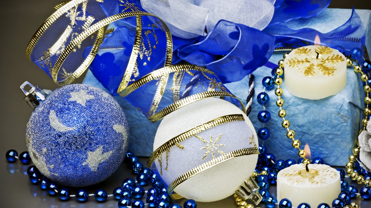 Christmas balls, gift with ribbon and candles for the New Year 2019