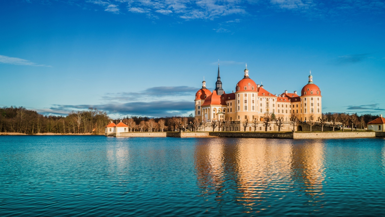 Moritzburg Castle by the Lake under the beautiful blue sky, Germany