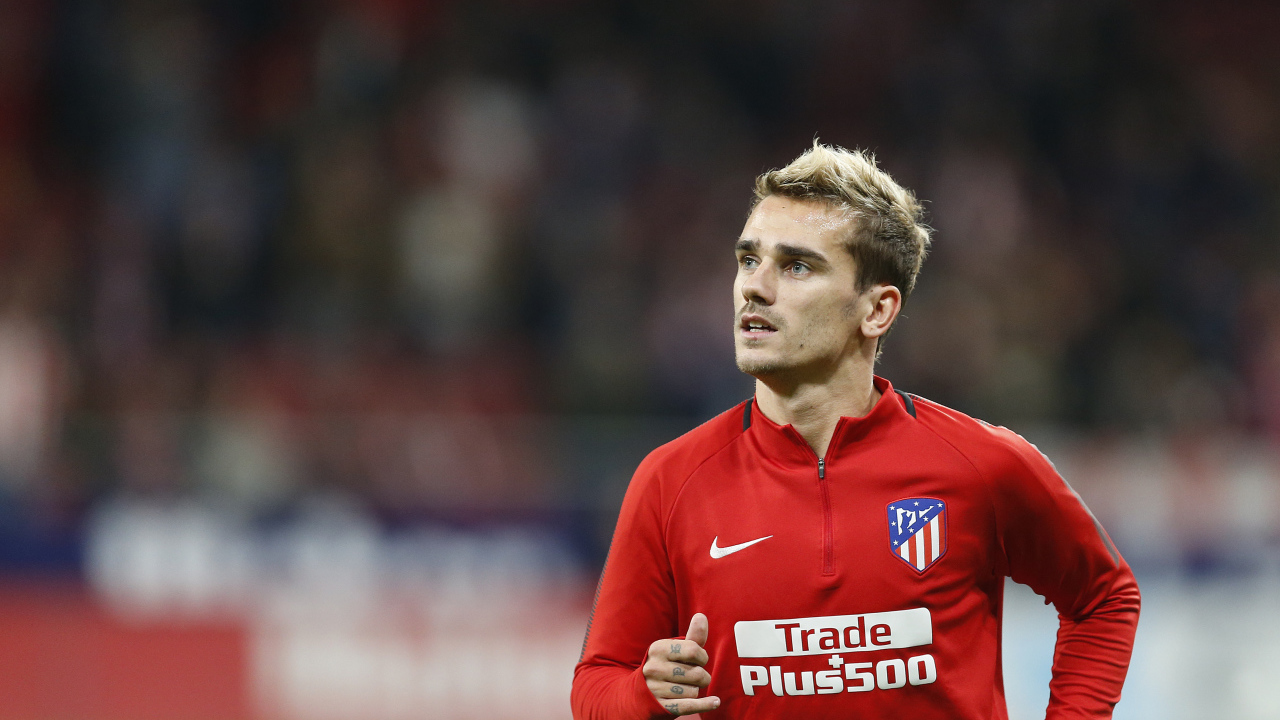 Football player Antoine Griezmann in red on the field
