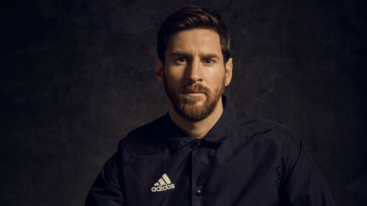 Football player Lionel Messi in a black shirt with a beard