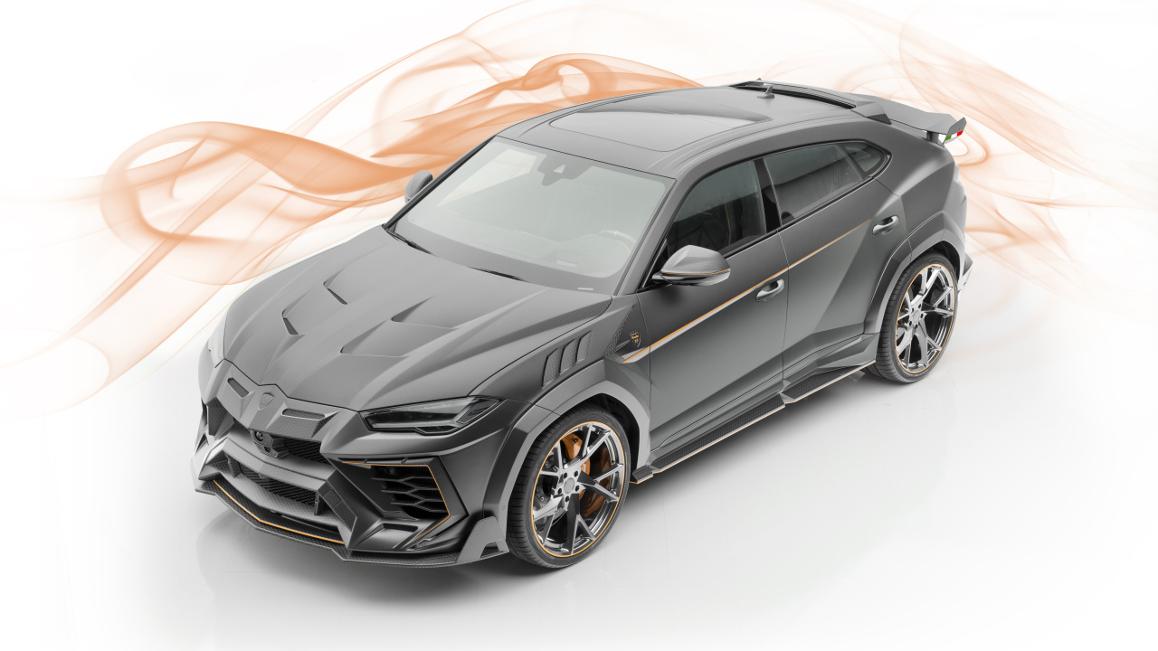 Серебристый автомобиль Lamborghini  Mansory Urus, 2019 года на белом фоне