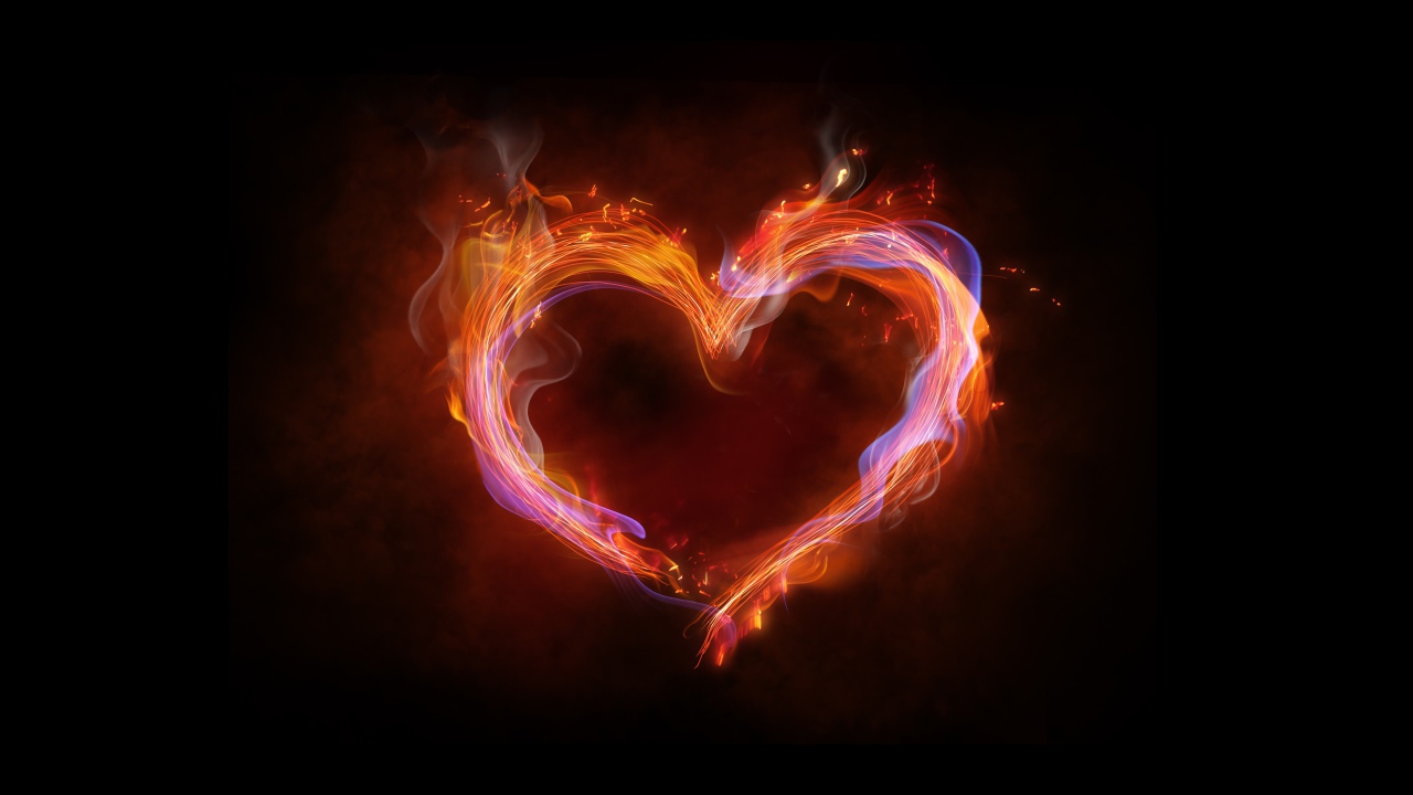 Огненное неоновое сердце на черном фоне