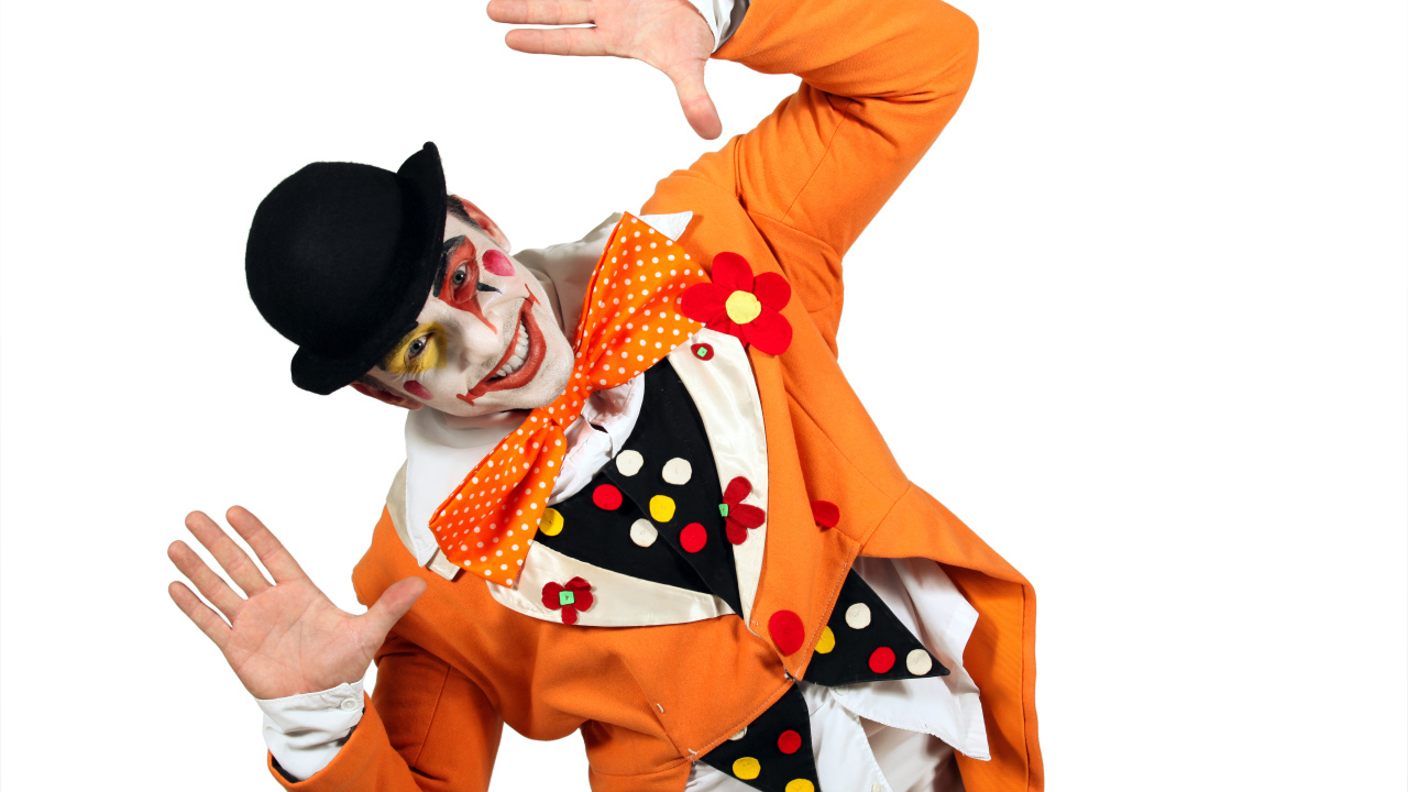 Smiling male clown on white background