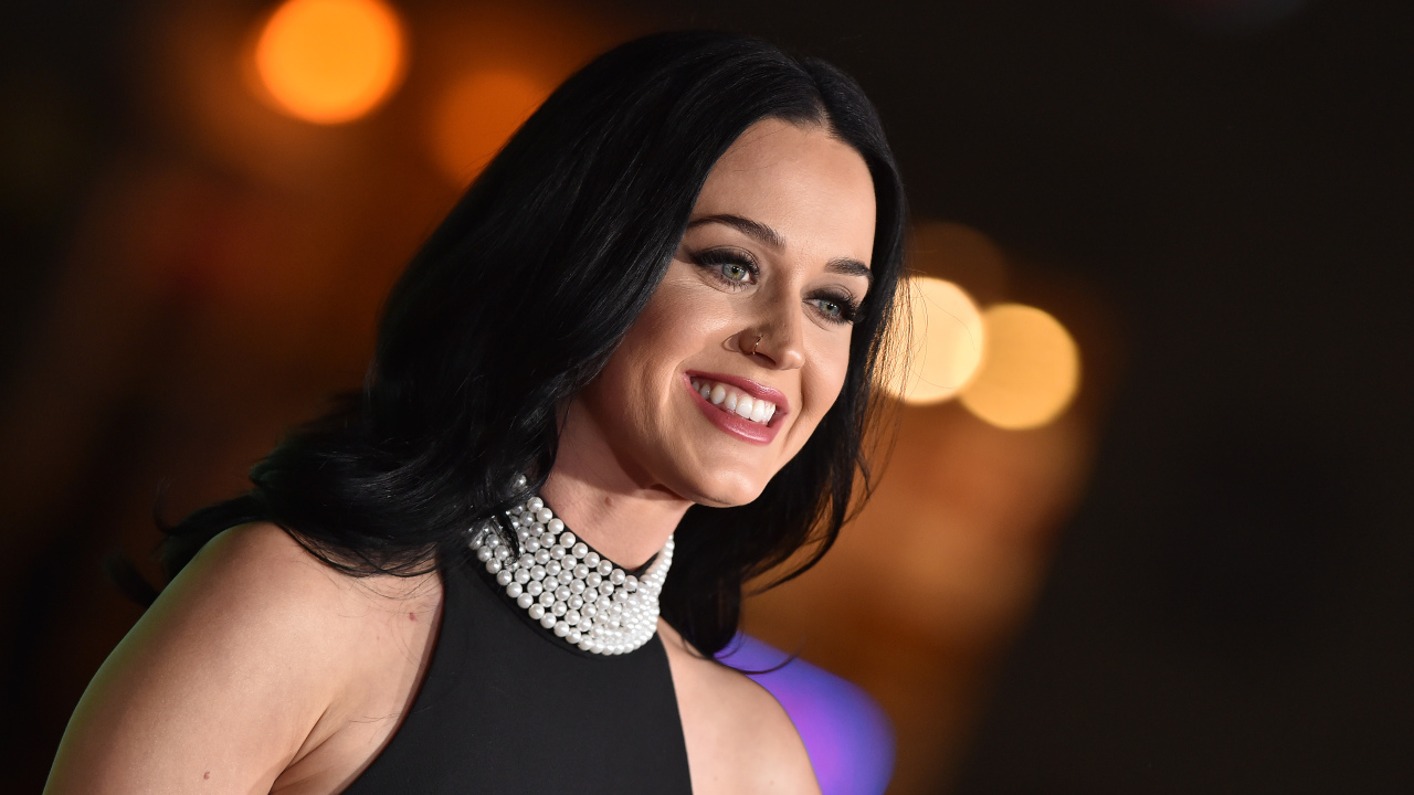 Smiling brunette girl, singer Katy Perry