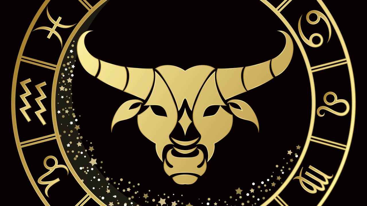 Золотой знак зодиака телец на черном фоне
