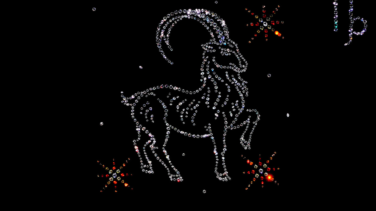 Блестящий знак зодиака козерог  на черном фоне