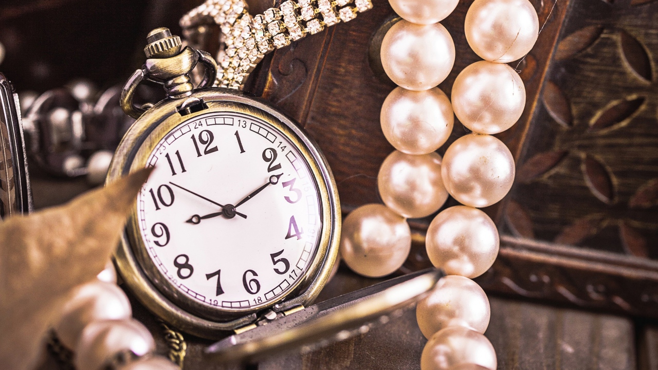 Pocket watch on a chain with pearl beads
