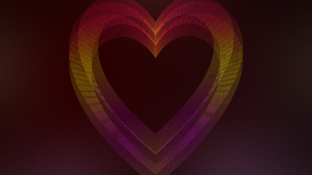 Большое неоновое сердце на бордовом фоне
