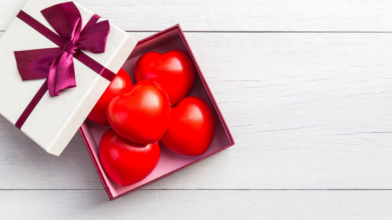 Red hearts in a box on a gray background