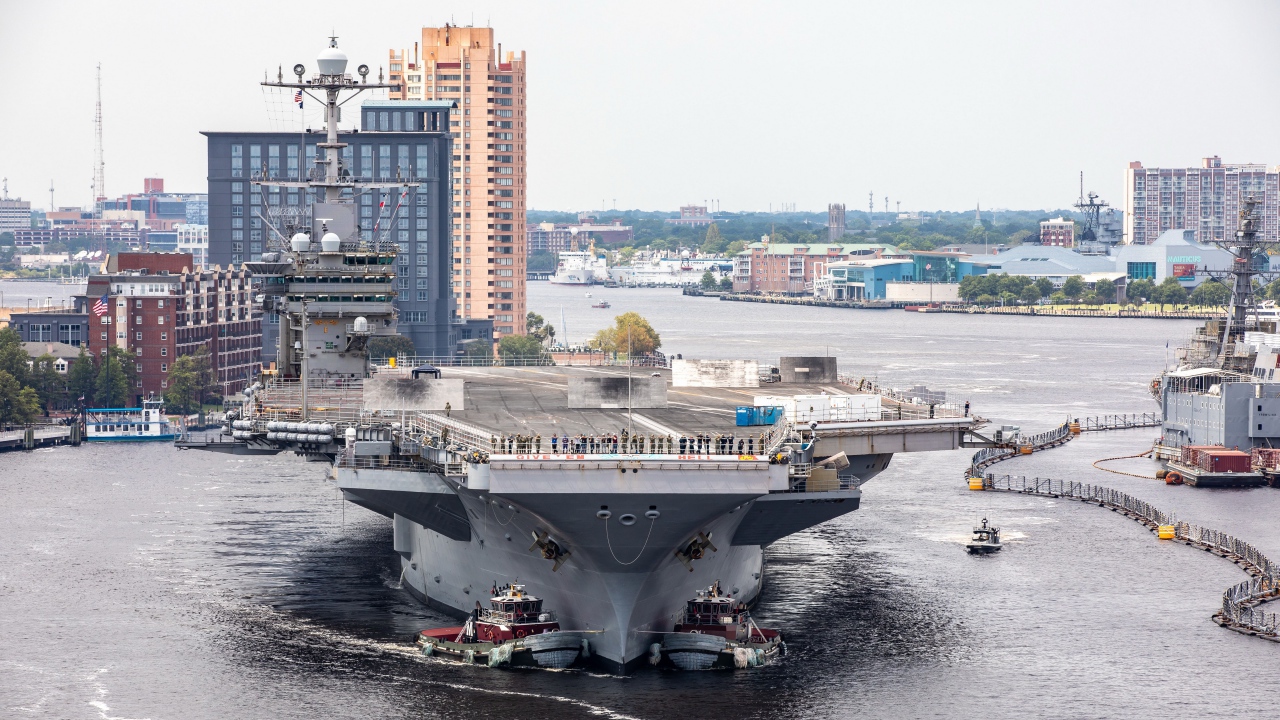 Large aircraft carrier in port