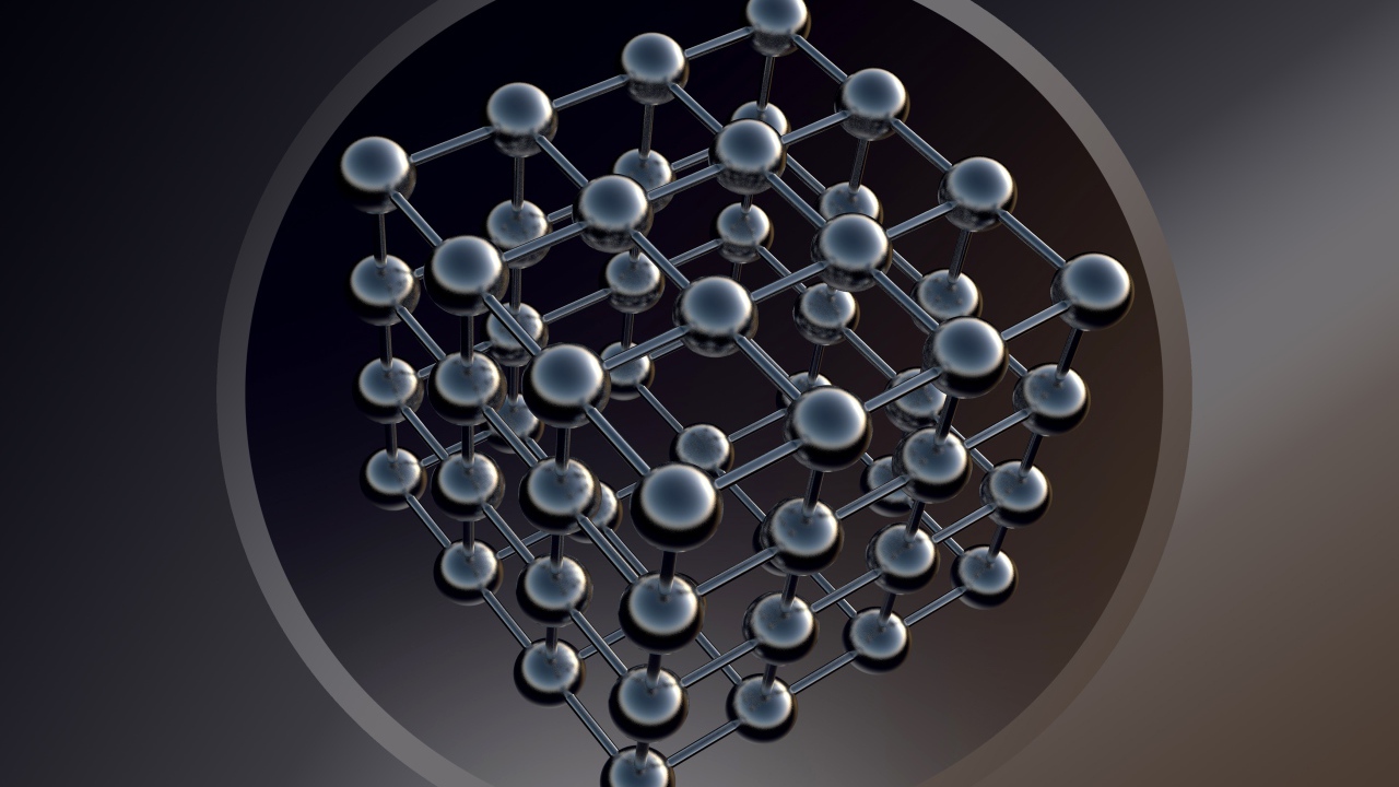 Шестигранник с черными шарами на сером фоне