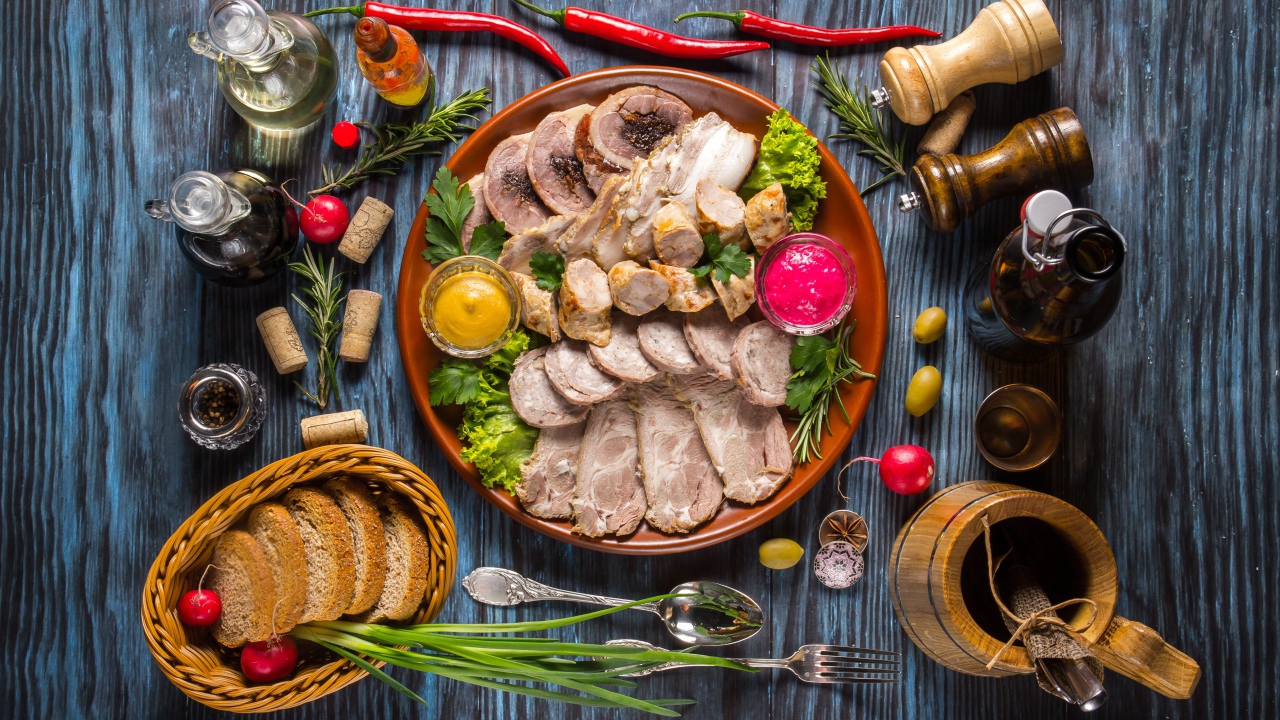 Appetizing cold cuts on the table with spices and bread