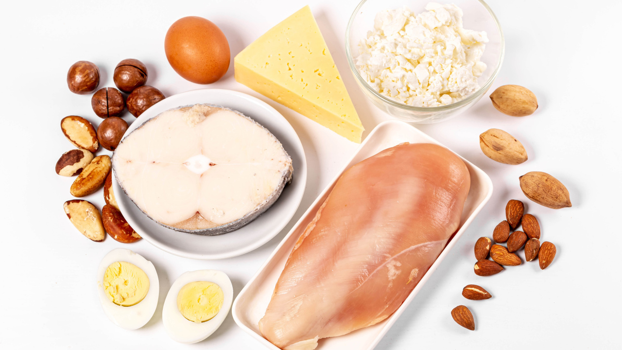 Fresh chicken, fish, nuts, cottage cheese and eggs on the table