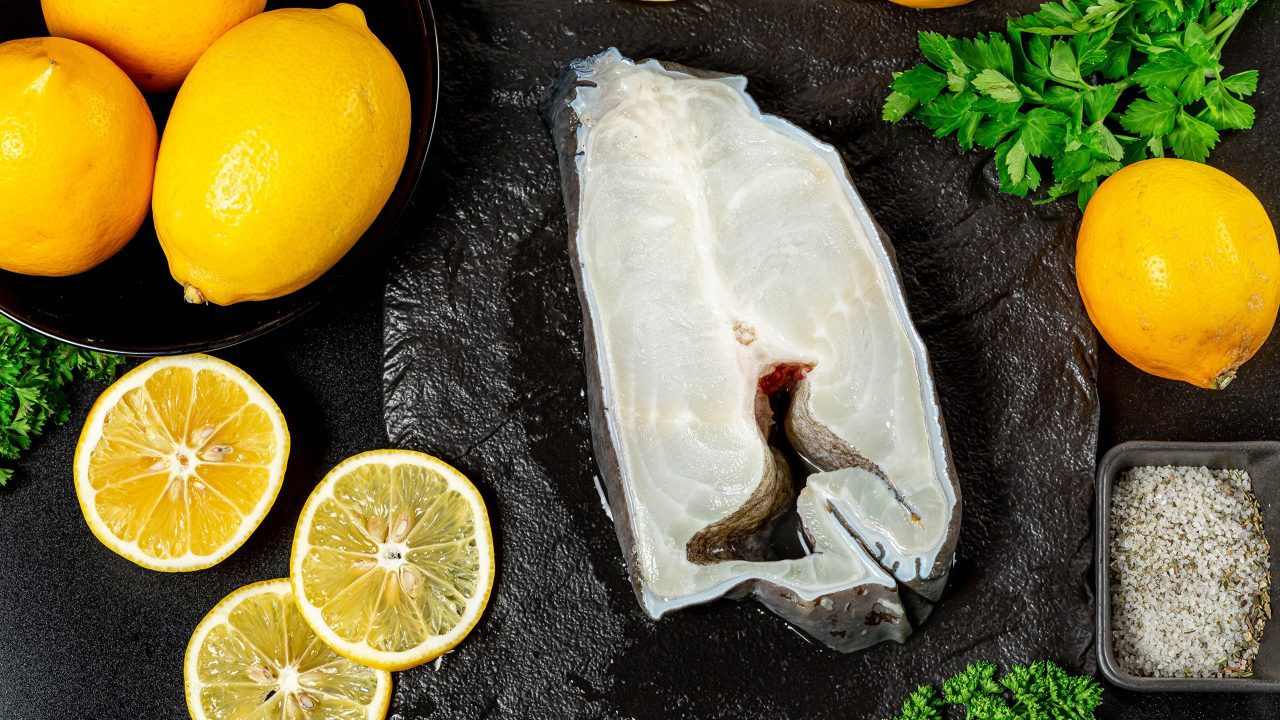Piece of fish with lemon and parsley