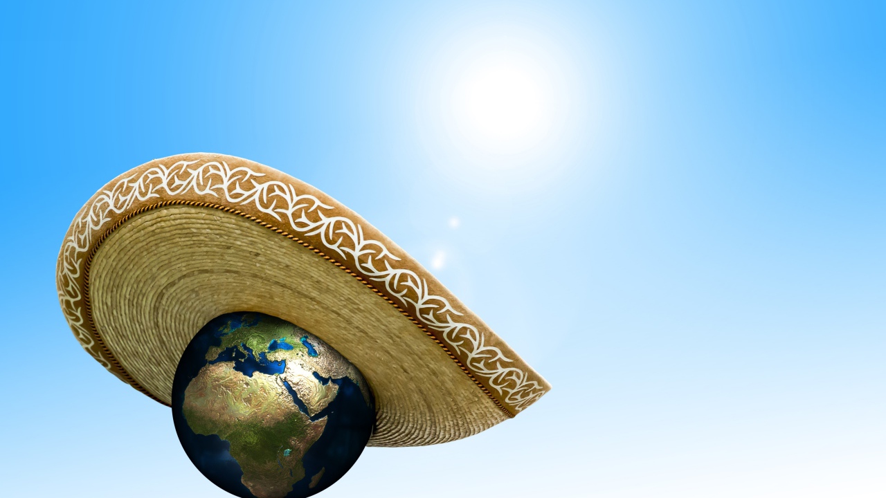 Планета земля в сомбреро на голубом фоне