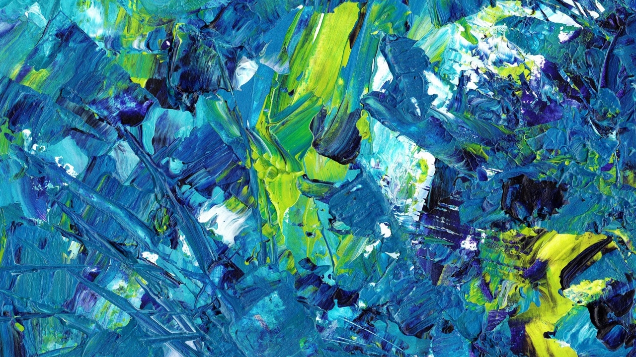 Синие и желтые краски смешанные на палитре