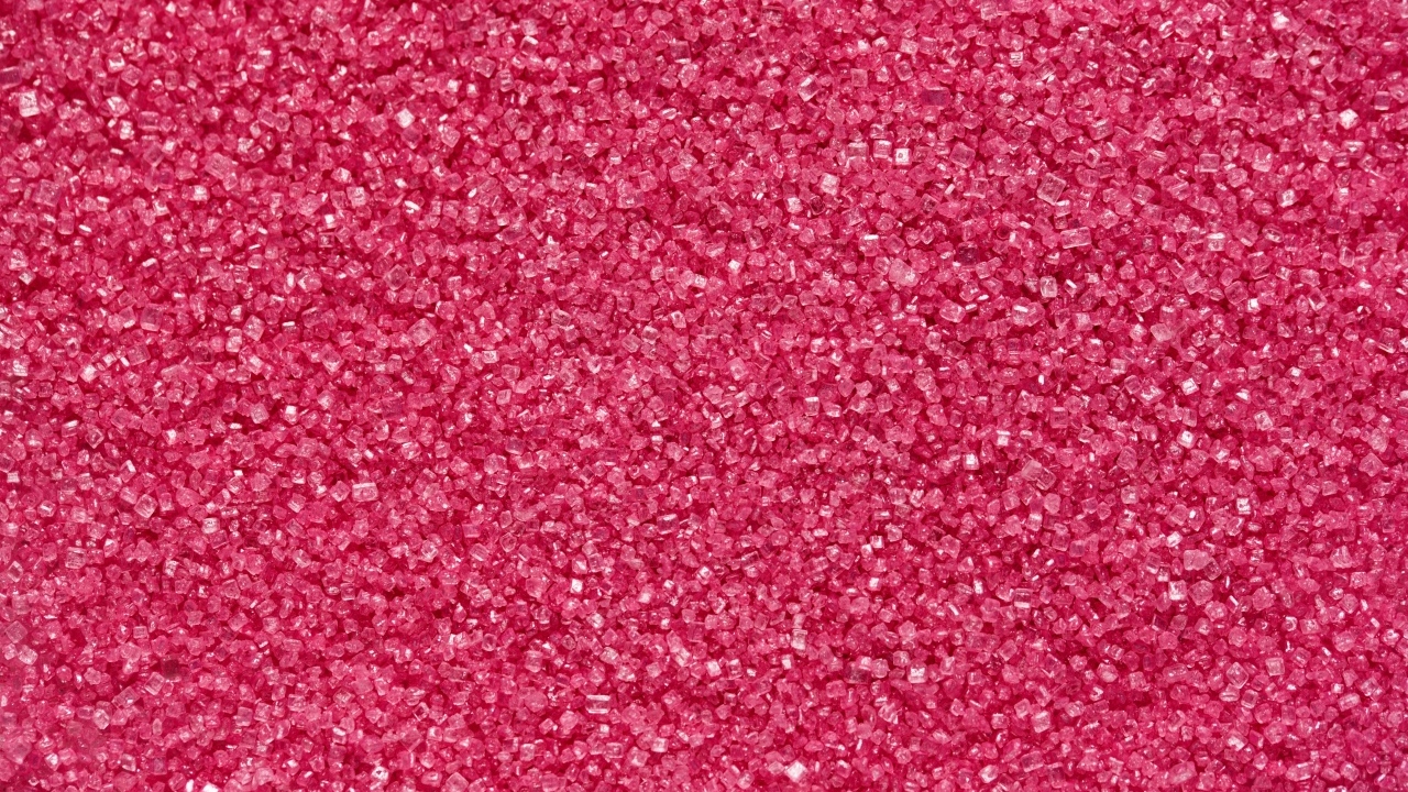 Мелкий розовый сахар для фона