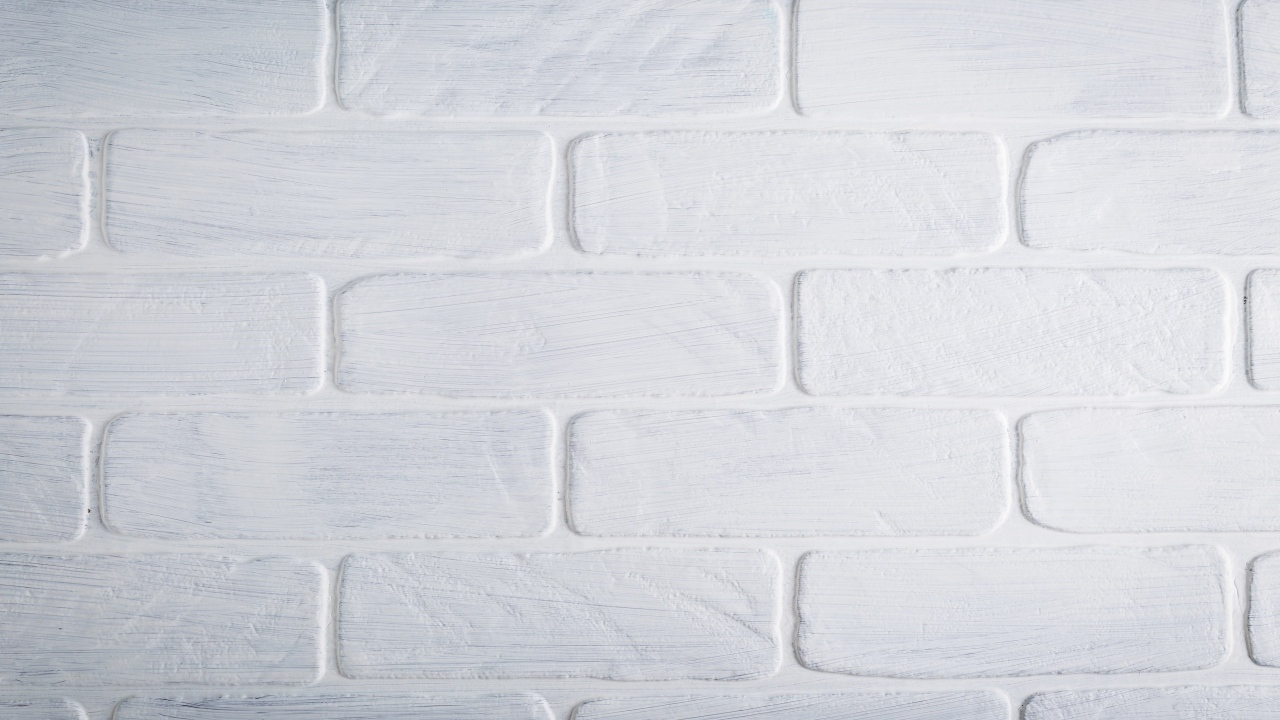 Белая кирпичная стена крупным планом