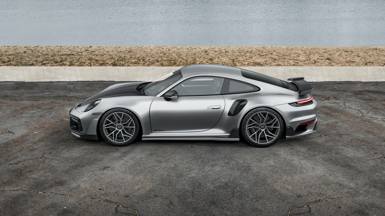 Вид сбоку на серебристый автомобиль TechArt GTsport 2024 года