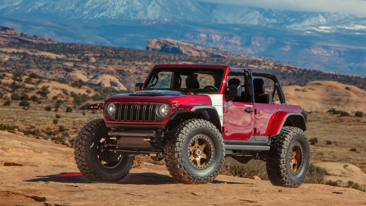 Красный внедорожник Jeep Low Down Concept 2024  года в горах