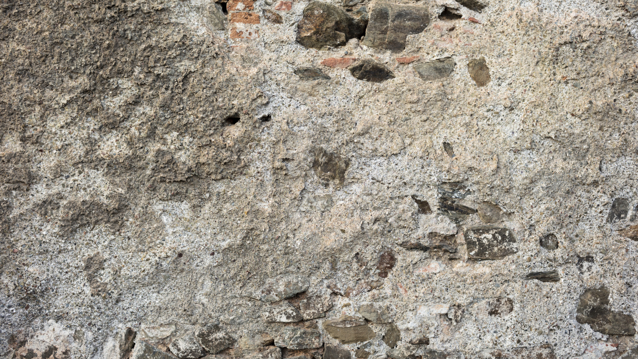 Старая текстурированная стена из цемента и кирпича для фона